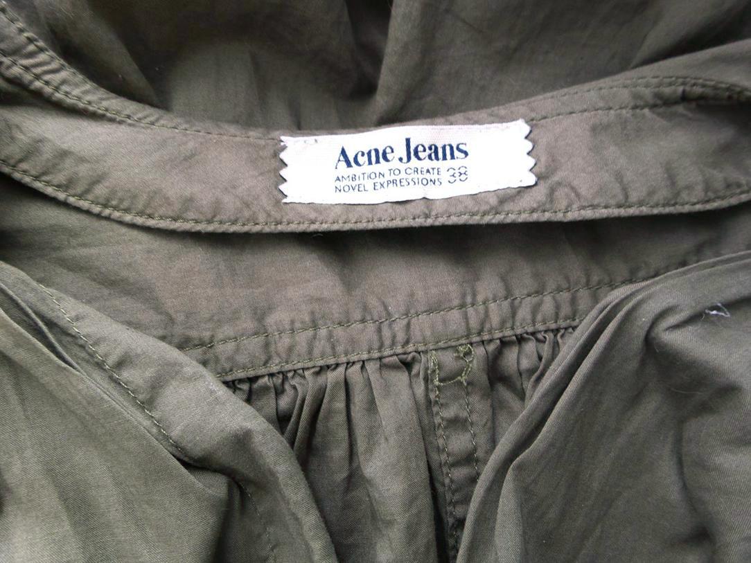 ACNE JEANS Rozmiar 38 Kolor Zielony W serek Tunika Zapinana Bluzka Krótki rękaw Materiał Bawełna 100% ACNE JEANS Rozmiar 38 Kolor Zielony W serek Tunika Zapinana Bluzka Krótki rękaw Materiał Bawełna 100%
