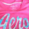 Aeropostale Rozmiar M Kolor Różowy Okrągły dekolt T-Shirt Krótki rękaw Materiał Bawełna 100%