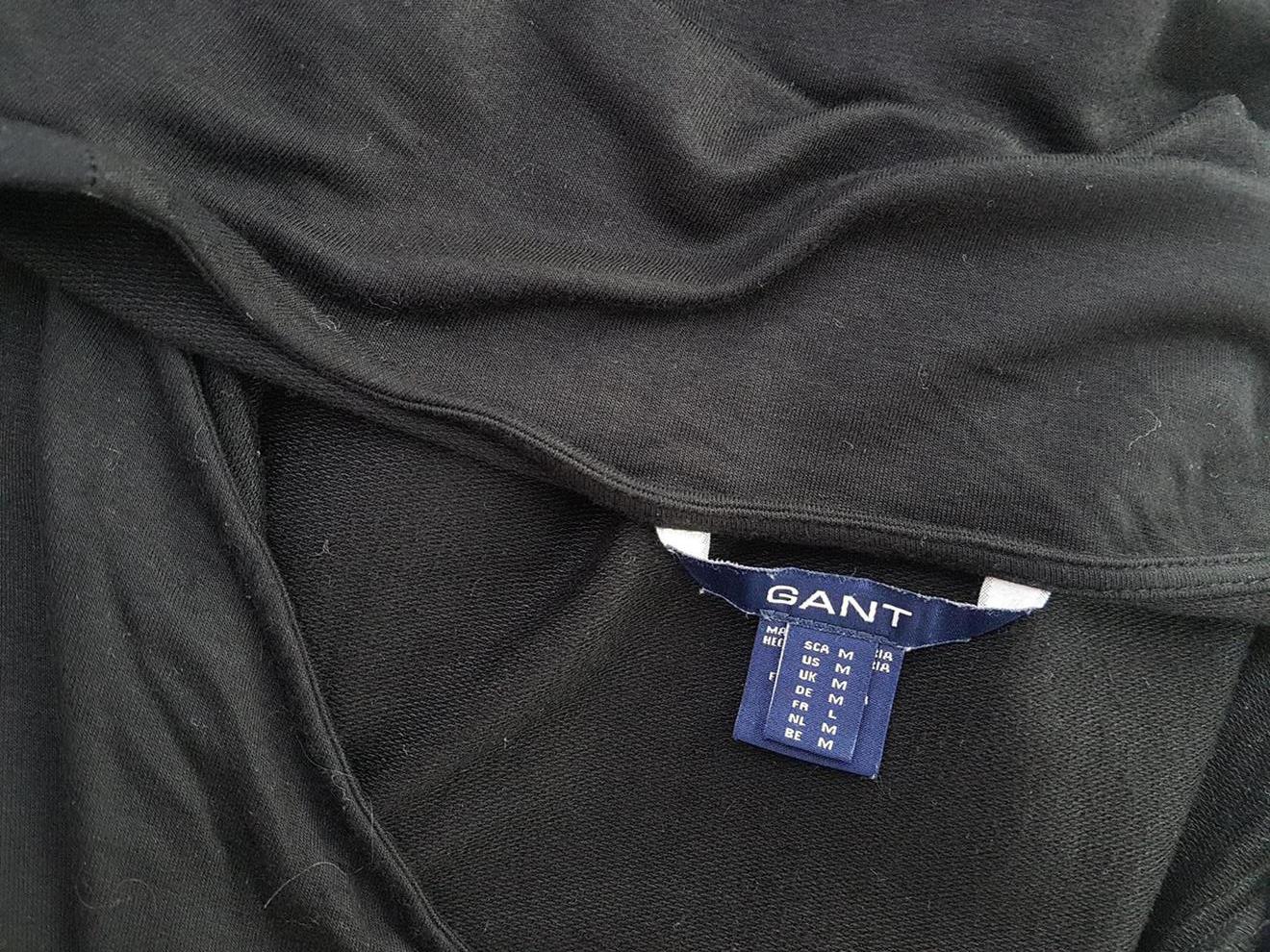 Gant Rozmiar M Kolor Czarny W serek Sukienka Zawijana Rękaw 3/4 Do Kolan Materiał Wiskoza Gant Rozmiar M Kolor Czarny W serek Sukienka Zawijana Rękaw 3/4 Do Kolan Materiał Wiskoza