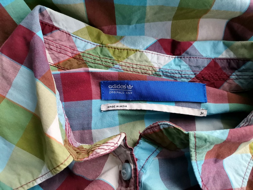 Adidas Rozmiar 34 Kolor Kolorowa Krata Kołnierz Tunika Zapinana Bluzka Krótki rękaw Materiał Bawełna 100% Adidas Rozmiar 34 Kolor Kolorowa Krata Kołnierz Tunika Zapinana Bluzka Krótki rękaw Materiał Bawełna 100%