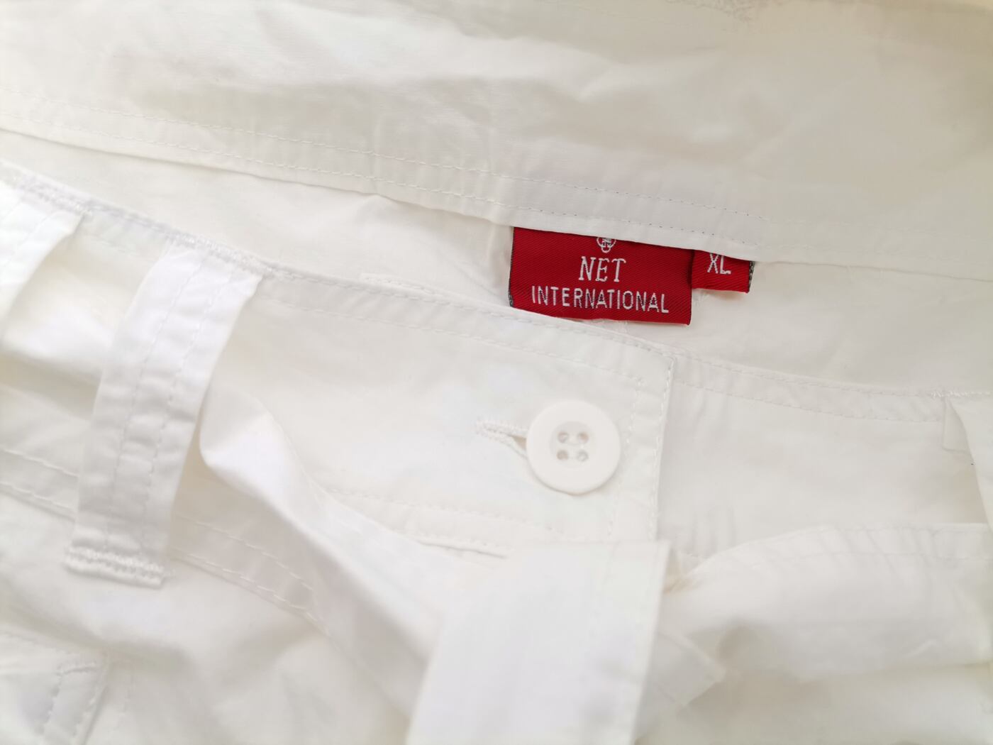 NET INTERNATIONAL Rozmiar XL (38-40) Kolor Biały Spodnie Casual Krótki rękaw Materiał Bawełna 100%