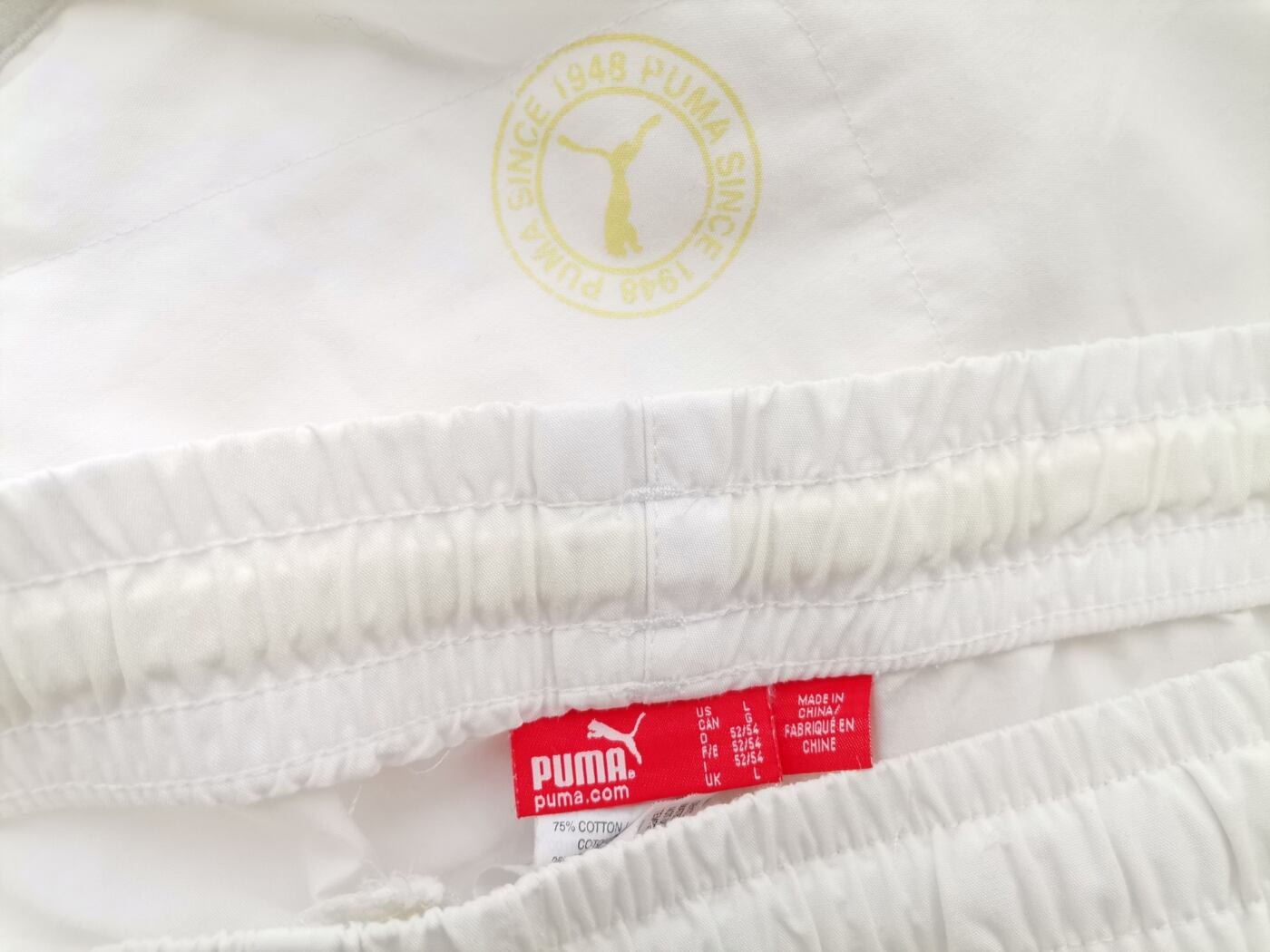 IMG_20210510_124844.jpg Puma Rozmiar L (52/54) Kolor Biały Spodnie Rybaczki Materiał Bawełna