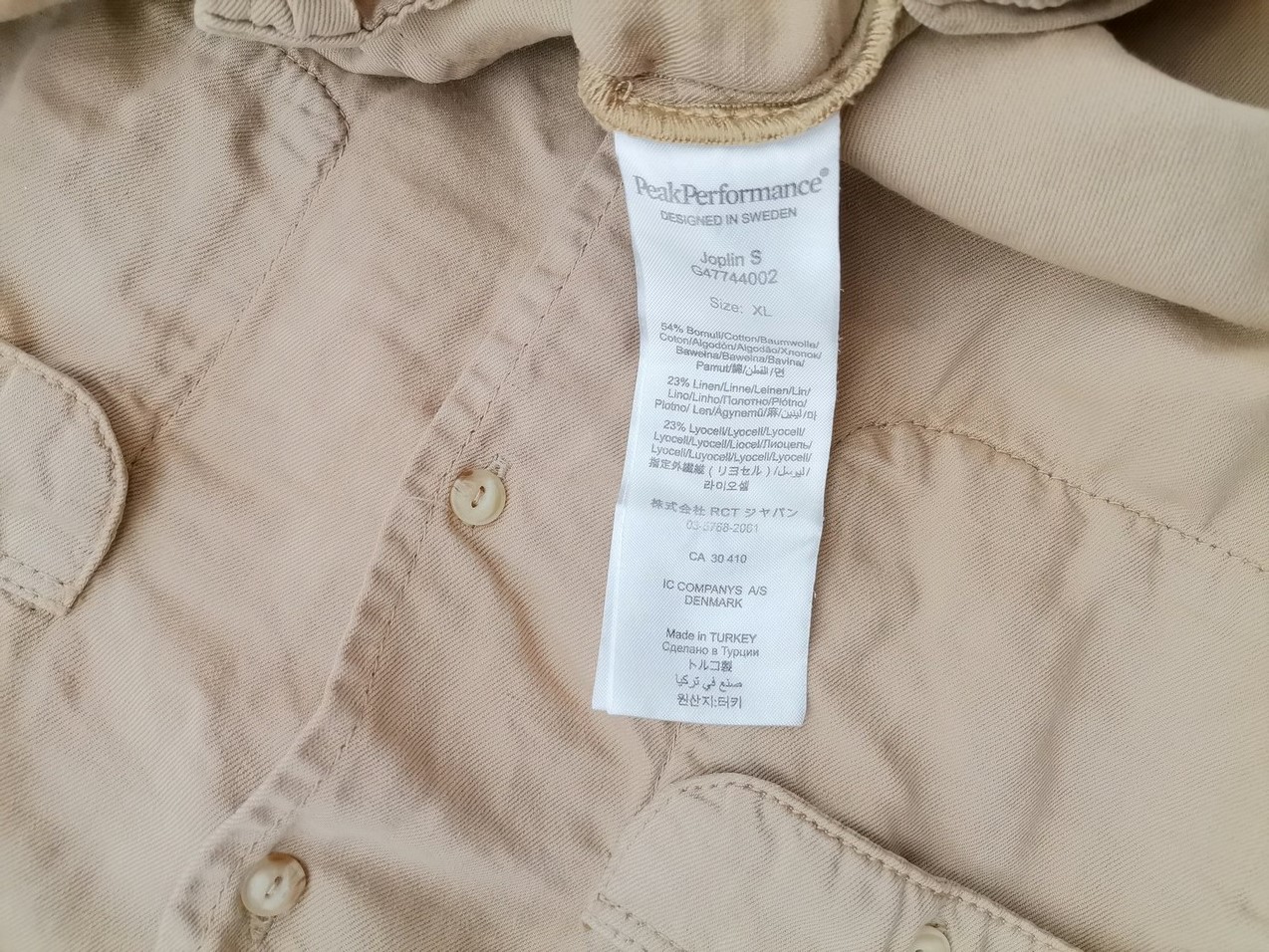Peak performance Rozmiar XL Kolor Beżowy Kołnierz Tunika Zapinana Bluzka Rękaw 3/4 Materiał Bawełna Peak performance Rozmiar XL Kolor Beżowy Kołnierz Tunika Zapinana Bluzka Rękaw 3/4 Materiał Bawełna