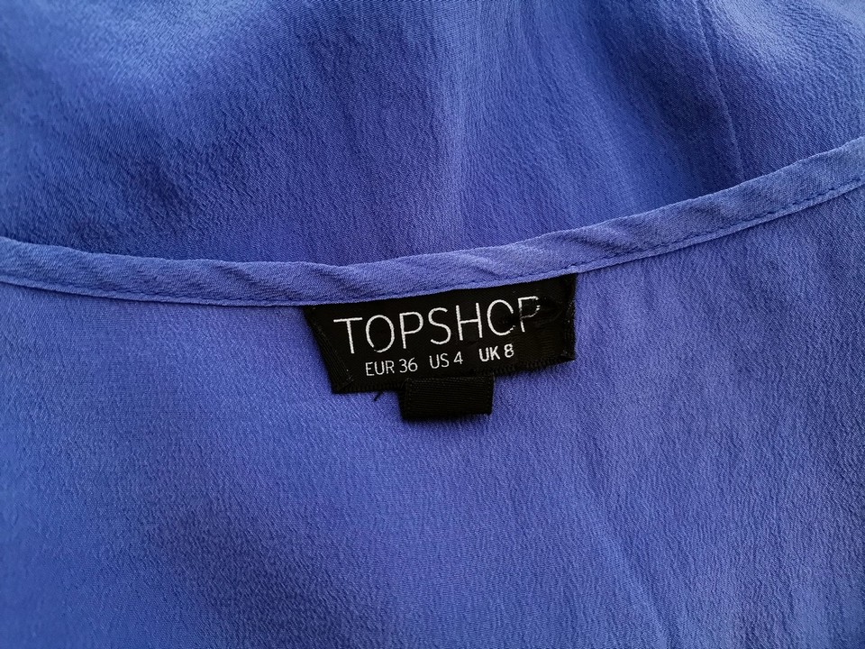 Topshop Rozmiar 36 Kolor Niebieski Okrągły dekolt Tunika Bluzka Krótki rękaw Materiał Jedwab 100% Topshop Rozmiar 36 Kolor Niebieski Okrągły dekolt Tunika Bluzka Krótki rękaw Materiał Jedwab 100%