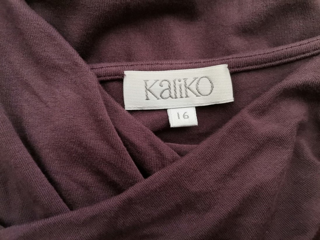 Kaliko Rozmiar 16 (42) Kolor Fioletowy Drapowany dekolt Sukienka Sheath Krótki rękaw Midi Materiał Wiskoza Kaliko Rozmiar 16 (42) Kolor Fioletowy Drapowany dekolt Sukienka Sheath Krótki rękaw Midi Materiał Wiskoza
