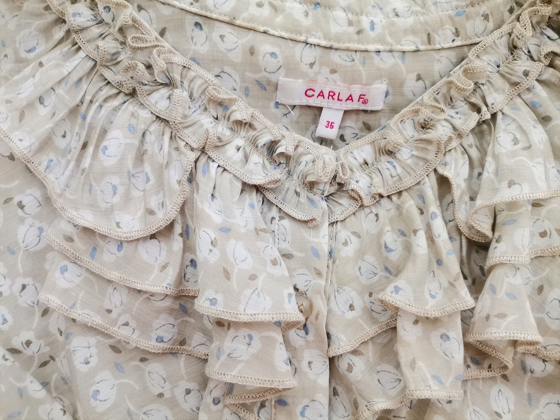 IMG_20220804_134113.jpg Carla F Rozmiar 36 Kolor Beżowy Okrągły dekolt Bluzka Zapinana Krótki rękaw Materiał Rayon